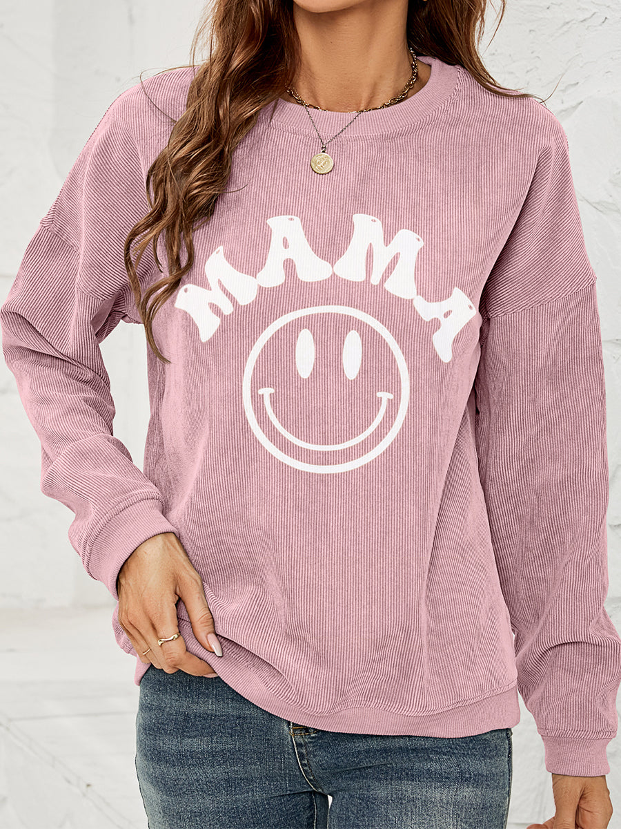 Corded sweatshirt in pink with smiley face and says "MAMA"